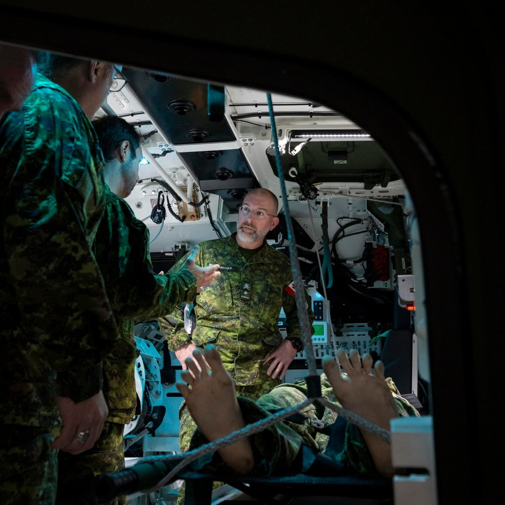 Major Gartner showcasing the new Armoured Combat Support Vehicle (ACSV) to Brigadier General Malcom and Group Chief Petty Officer First Class Simpson at 2 Field Ambulance (2 FD AMB), Garrison Petawawa, Petawawa ON, 25 October 2023
Please credit: Corporal Jacob Hanlon, Canadian Forces Photo